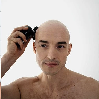 bald guy holding Top Head Shaver
